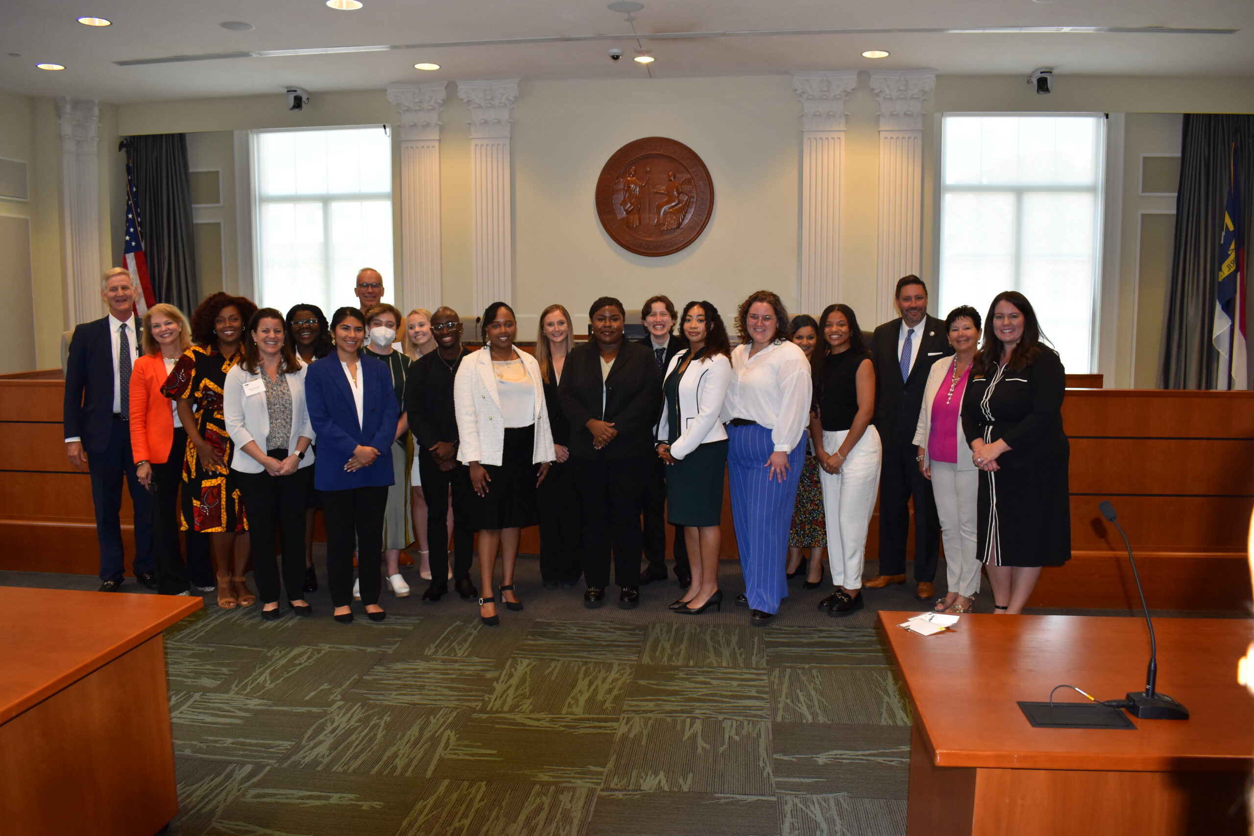 Interns including Emmy Scott, sixth from left, and guests including Judge Tom Langan, third from left, pose for a photo following the September luncheon celebrating the 2024 program participants.